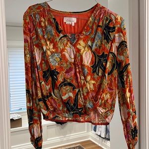 Orange floral blouse with wrap detail